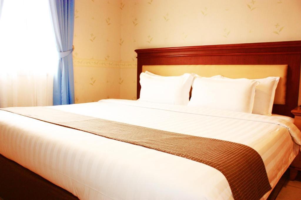 Travellers Suites Serviced Apartments Medan Phòng bức ảnh