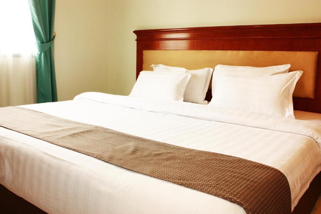 Travellers Suites Serviced Apartments Medan Phòng bức ảnh