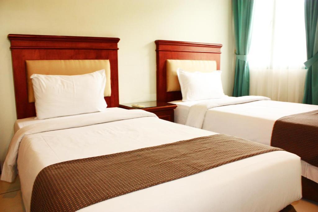 Travellers Suites Serviced Apartments Medan Phòng bức ảnh