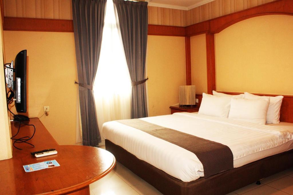 Travellers Suites Serviced Apartments Medan Phòng bức ảnh
